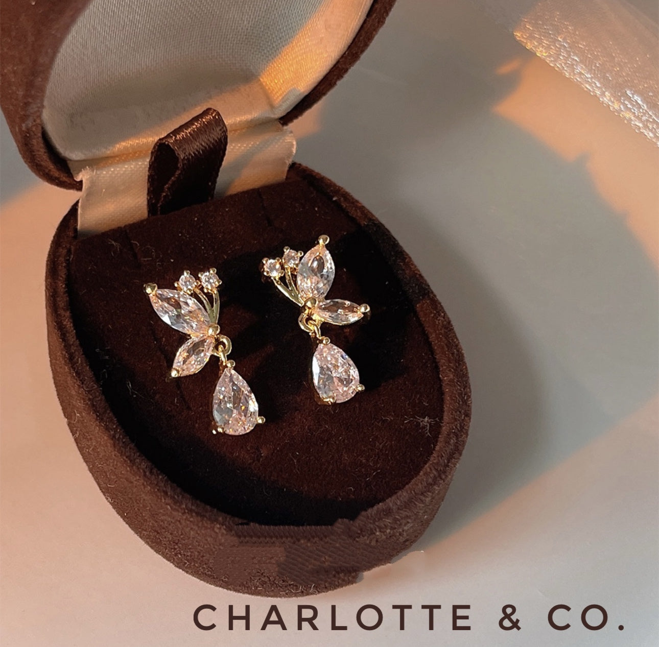 韓系吊水晶半蝶耳環